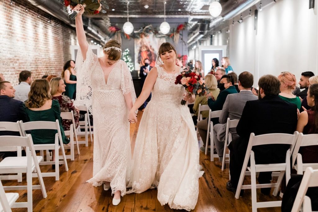 Two brides celebrate after their intimate wedding ceremony in Fredericksburg, VA