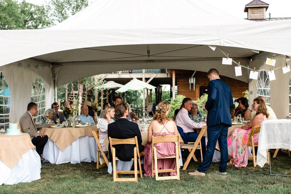 The brother of the bride gives a toast in an intimate wedding reception at a vineyard outside of Harrisonburg, Virginia