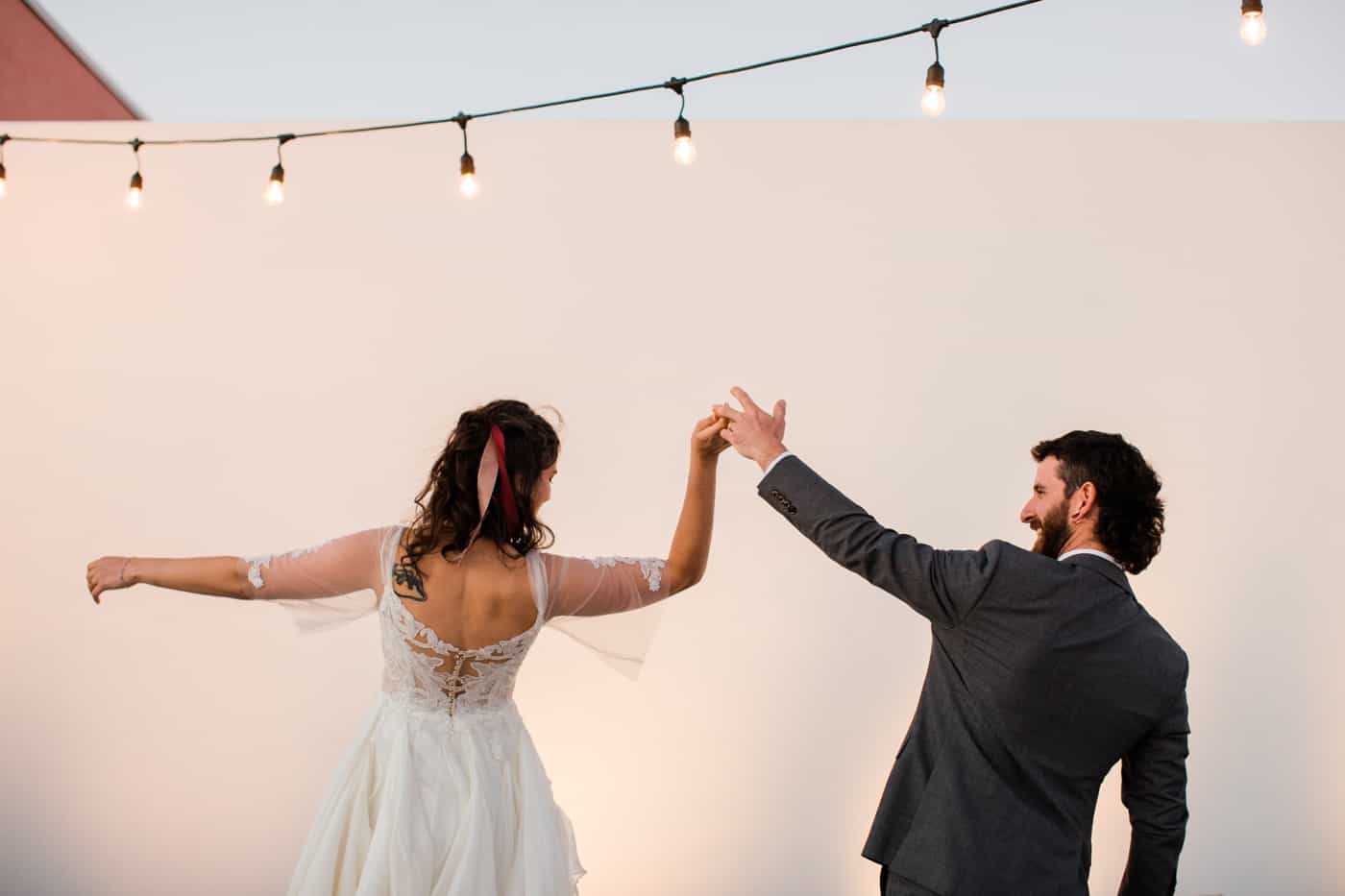 A couple dances on the rooftop of the Quirk Hotel in Charlottesville after getting married