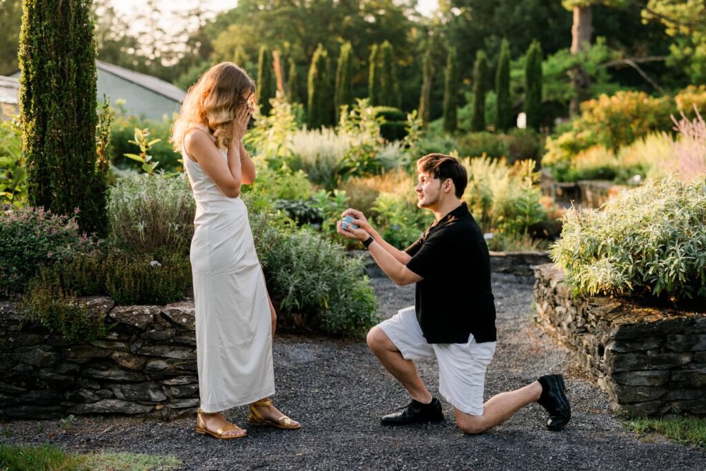 A couple celebrates their engagement at the State Arboretum of Virginia